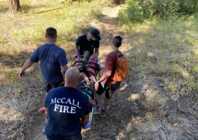 EMS hiking down a hill